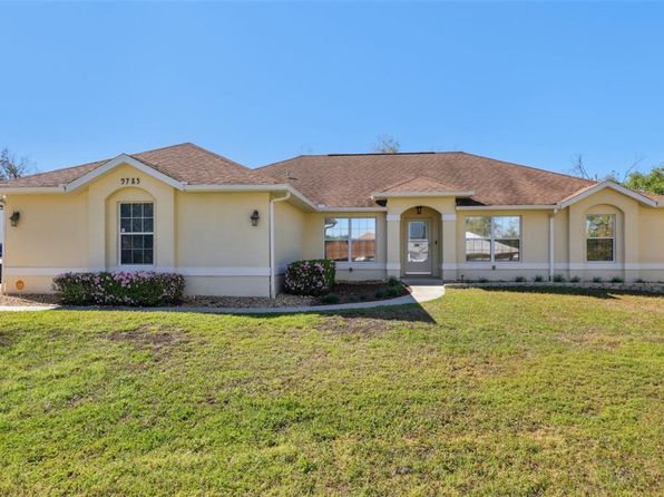 Single-family ranch home with spacious front yard in Lake City