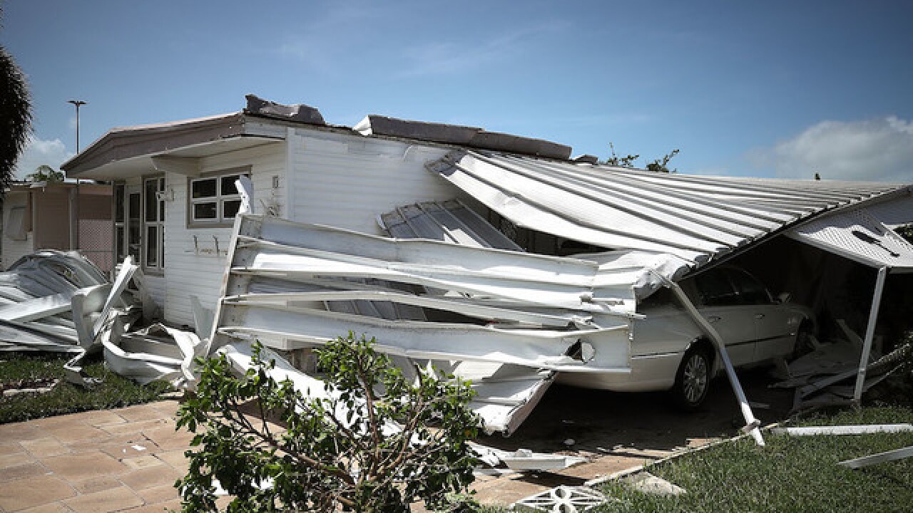 Florida home with severe roof and carport damage